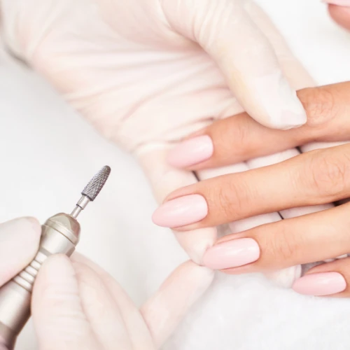 Image of woman receiving a nail service at Lusso Hair Studio & Spa located in Winston-Salem, NC