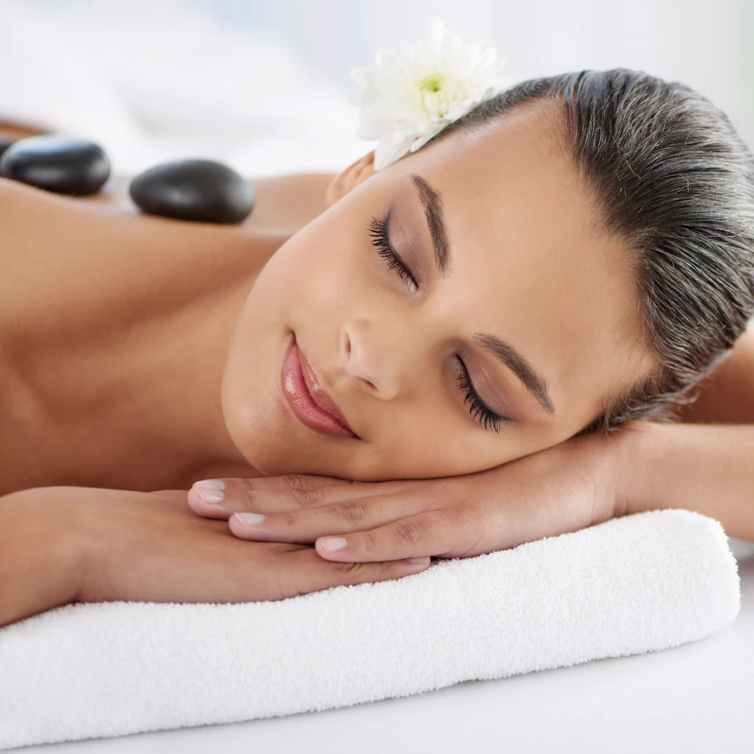Image of hot stone massage at Lusso Hair Studio & Spa located in Winston-Salem, NC.